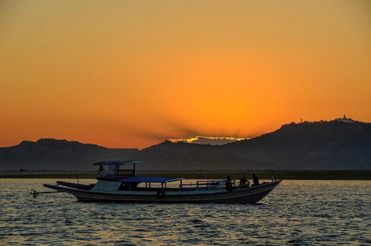 Overnight dhow cruise in Musandam fjords with scenic mountains and calm sea
