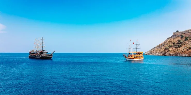 Traditional dhow cruising through Khasab Musandam fjords